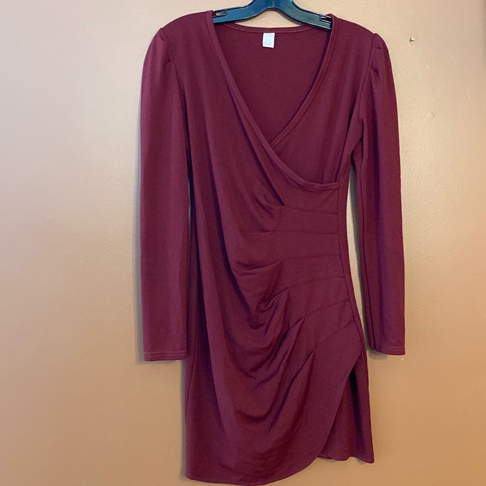Beautiful burgundy dress with wrap over style in the front. Size small.